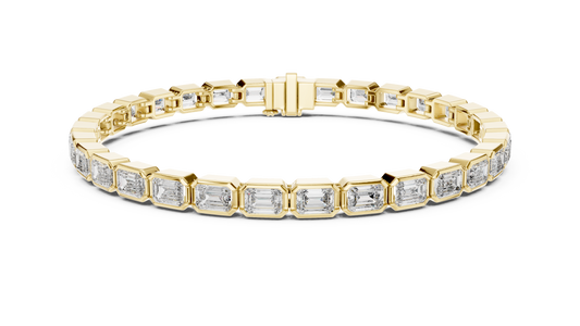 Gold bracelet with diamond accents on a white background