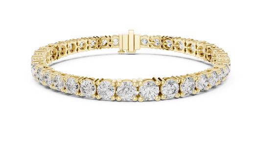 Gold bracelet with diamond stones on a white background