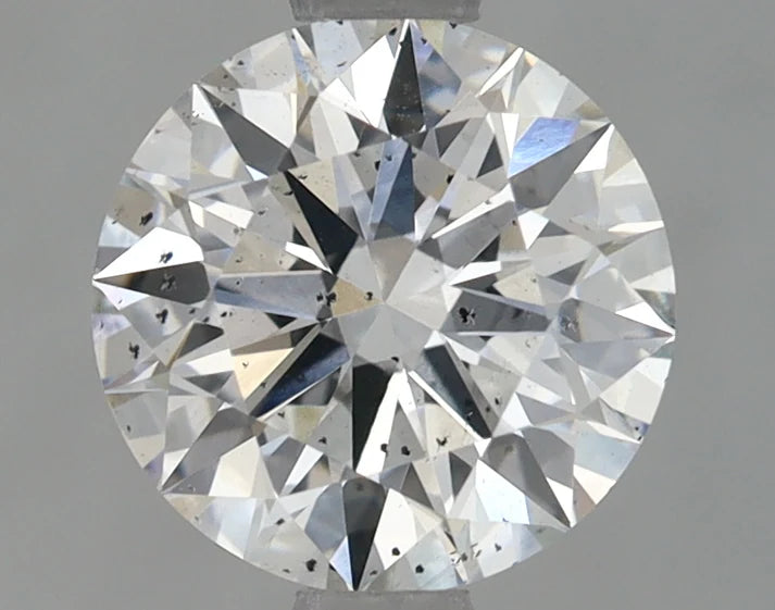 Round cut diamond on a gray background