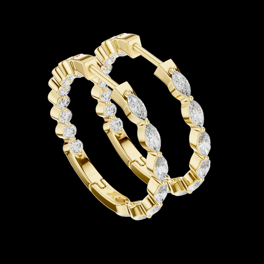 Gold hoop earrings with diamond accents on a black background