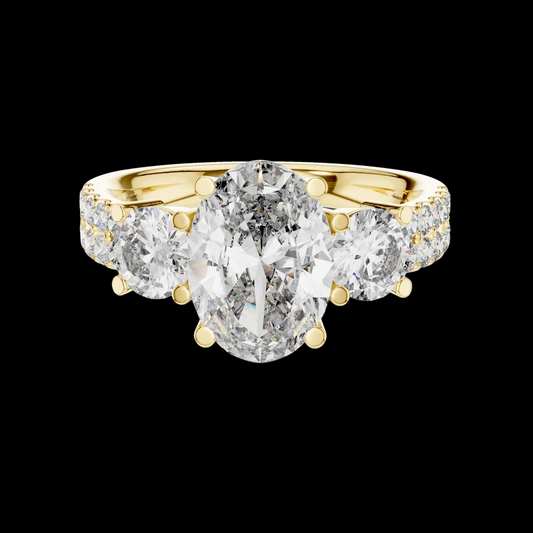 Gold ring with a large central diamond and smaller diamonds on the sides against a white background