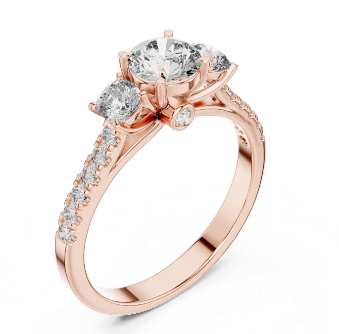 Rose gold ring with Three clear gemstones on a white background