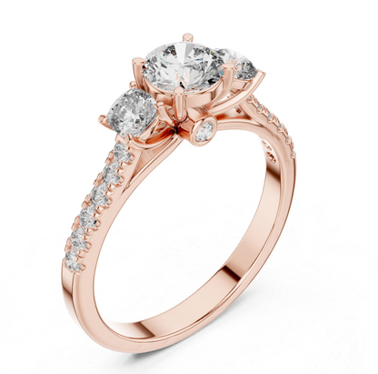 Rose gold ring with Three clear gemstones on a white background