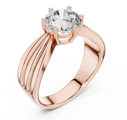 Rose gold ring with a large diamond on a white background