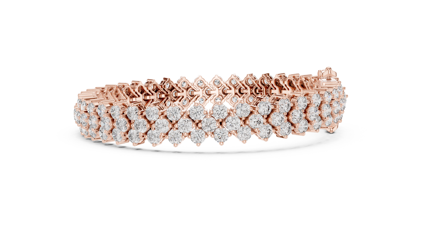 Rose gold bracelet with diamond accents on a white background
