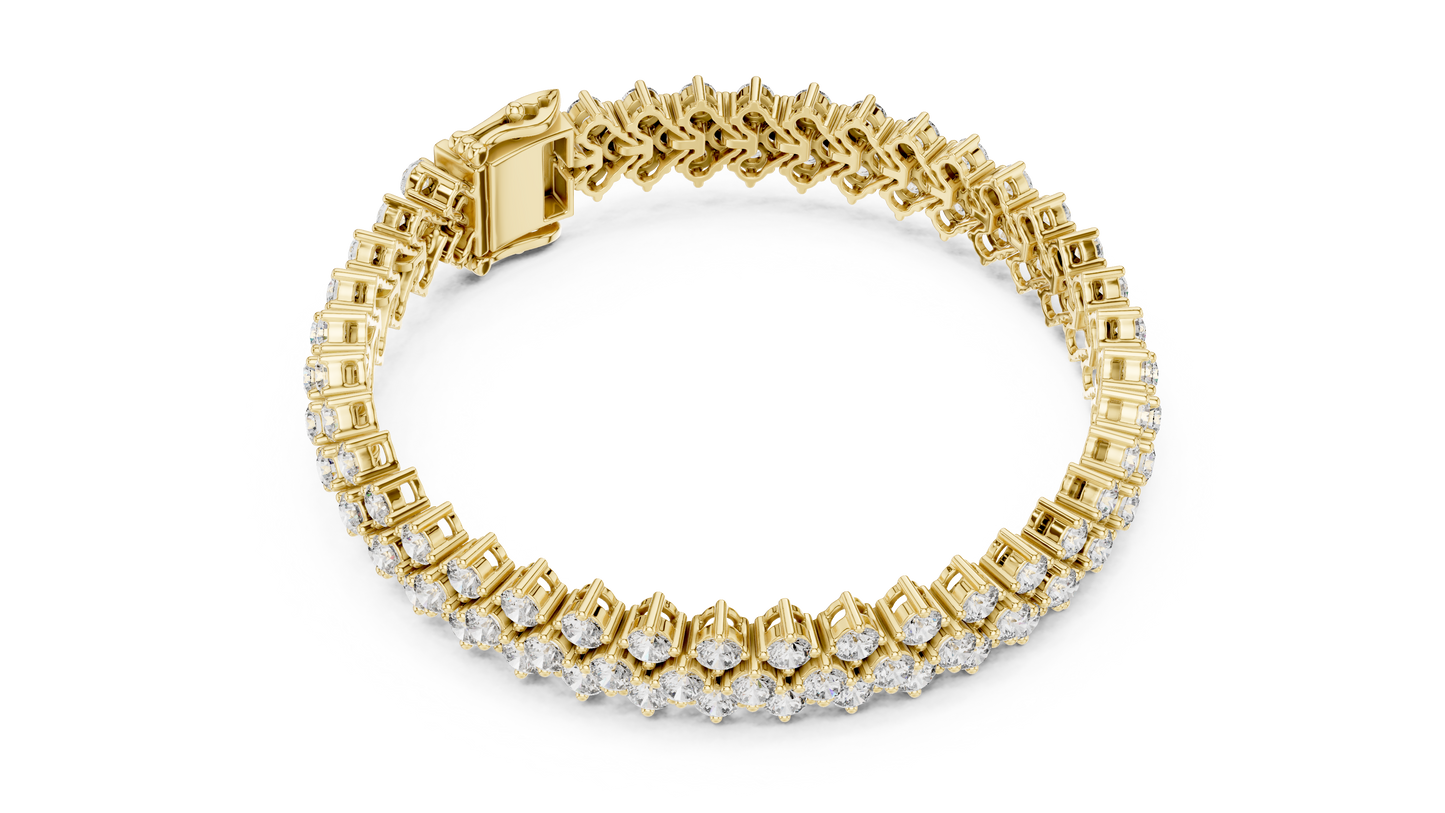 Gold bracelet with diamond accents on a white background