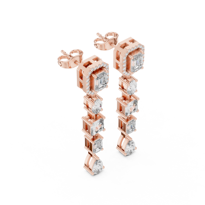 Rose gold earrings with clear gemstones on a white background