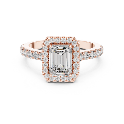 Rose gold ring with emerald-cut diamond and smaller diamonds on a white background