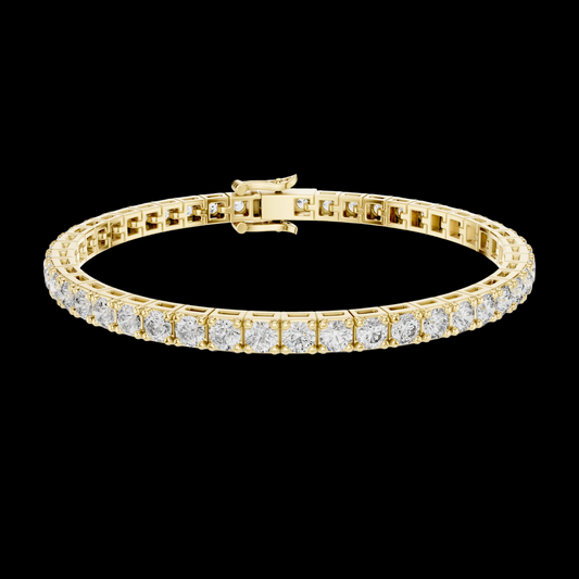 Gold bracelet with diamond accents on a white background